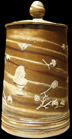 Example of dipped and mocha decorated refined white earthenware tankards were embellished with sprig molded seals bearing crowns or other imperial emblems.